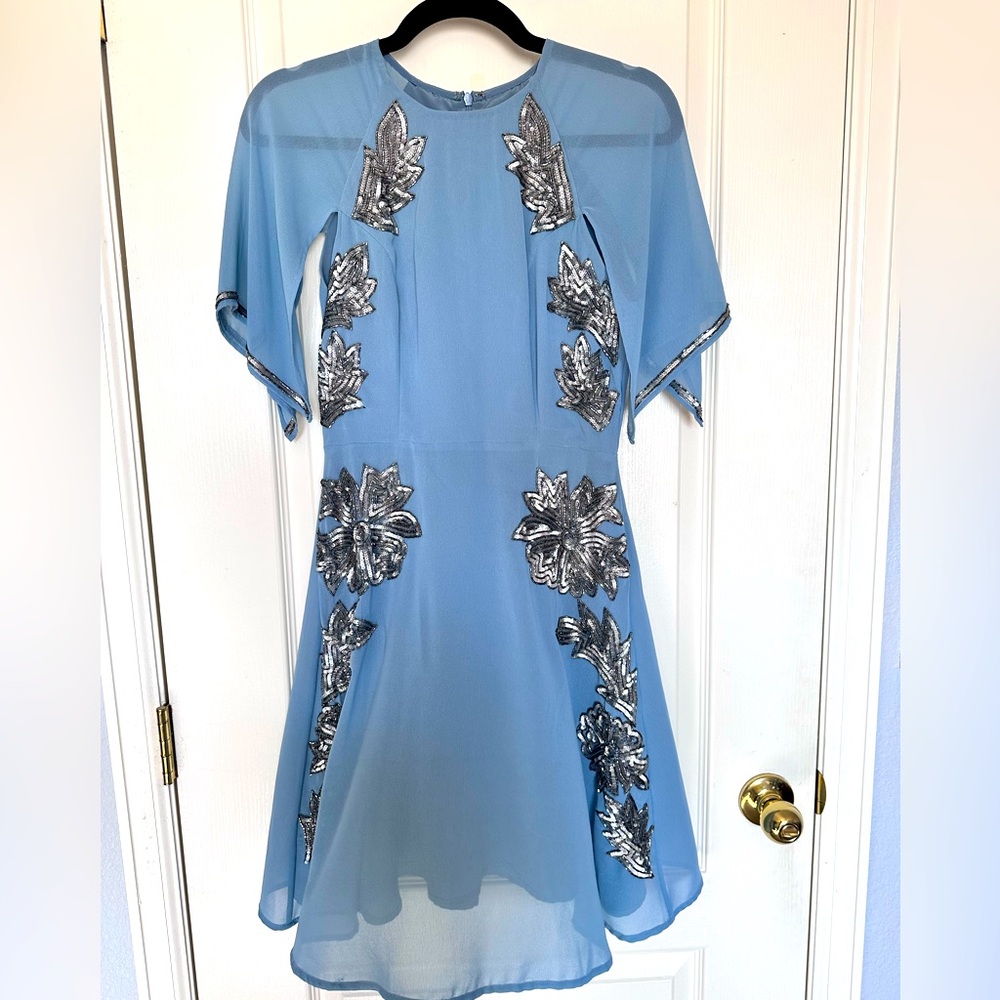 Stunning pale blue dress with floral sequin detail.